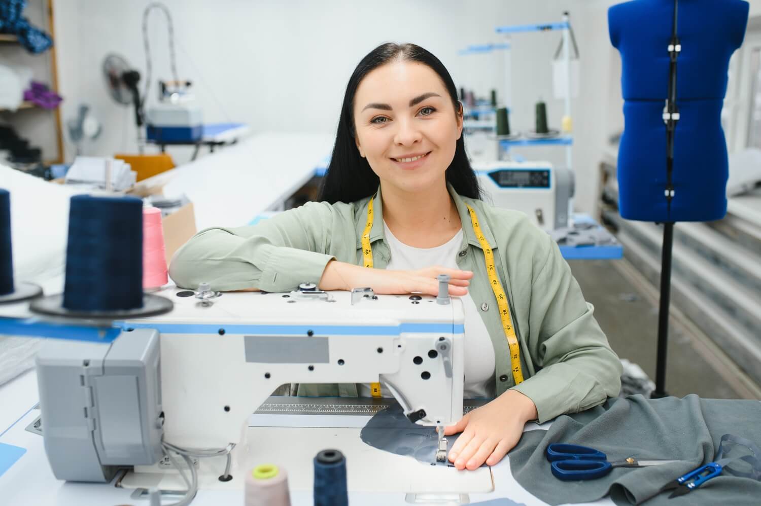 portrait-of-a-beautiful-seamstress-carrying-a-tape-CSQMUNP.jpg